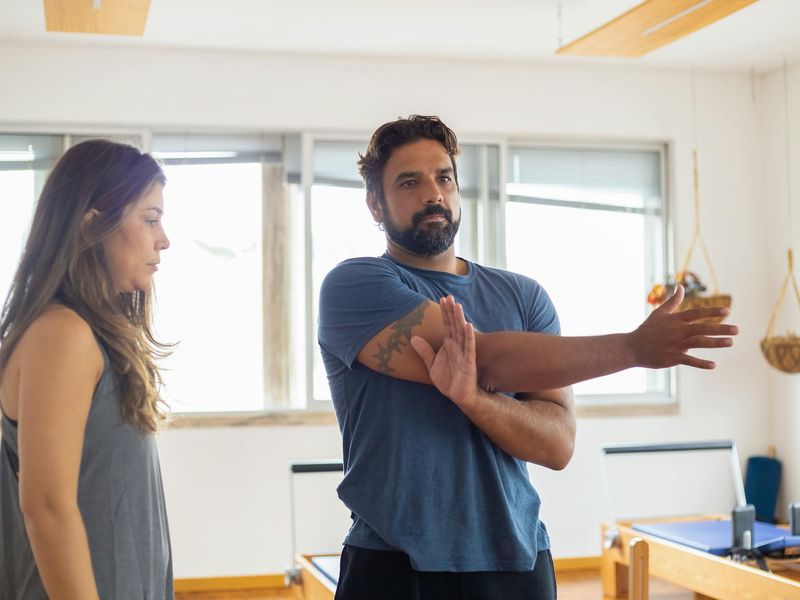 Man stretching his arms during a morning workout session